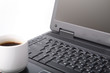 modern laptop and cup of hot coffee modern laptop and cup of hot coffee