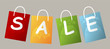Set of price tags spelling out SALE on grey background