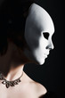Dark portrait of a girl with white mask Dark portrait of a girl with white mask