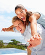 Closeup of a young man and his girlfriend stretching their hands