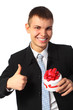 young smiling businessman with gift  box