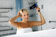 girl in bathroom with drier