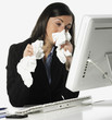 Photo: .Beautiful young business woman with a cold blowing nose .Beautiful young business woman with a cold blowing nose