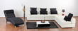 A modern minimalist living-room with white furniture
