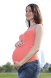 A pregnant woman at park