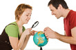 Couple looking at globe
