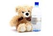 Teddy bear likes natural mineral water. Concept. Teddy bear likes natural mineral water. Concept.