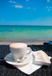 Cup of coffee at the beach