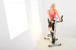 Woman working out on spinning bike