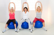 Elder women exercising on fitness balls