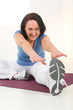 Woman stretching on mat