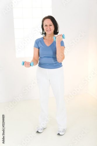Photo: Woman with dumbbell Woman with dumbbell