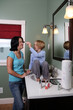 little girl applying makeup to teenager