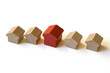 Five wooden houses  from “Monopoly” on white background