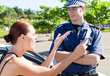 Foto: female driver angry at a traffic police over a ticket female driver angry at a traffic police over a ticket