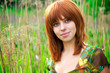 Portrait of a beautiful woman with red hair