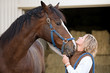 Photo: Woman's and Horse's Faces Together Woman's and Horse's Faces Together