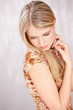 pretty blond woman looking down, copy space on left side