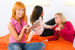 Young women applying makeup