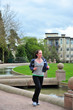 Woman jogging in a park.
