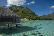 Mountainious tropic island with bungalow and lagoon