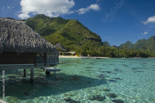 Photo: Mountainious tropic island with bungalow and lagoon Mountainious tropic island with bungalow and lagoon