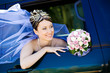 portrait of the bride in the wedding car