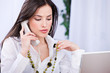 Business woman doing phone call in the office