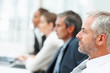 Profile view of a business man at a seminar