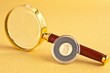 Coin and magnifier