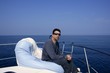 Man on bow boat relaxed on bean bag