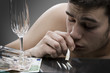 Young man sniffing cocaine.