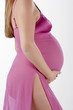 .mage of pregnant woman touching her belly with hands..