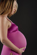 Image of pregnant woman touching her belly with hands..