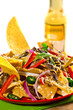 tortilla chips with salad and fresh beer on the background tortilla chips with salad and fresh beer on the background