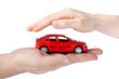 Red car in hands