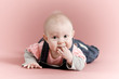 Baby girl with fingers in her mouth Baby girl with fingers in her mouth