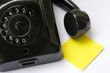 Photo: yellow note paper and old phone yellow note paper and old phone