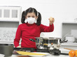 little girl in the kitchen with mask little girl in the kitchen with mask
