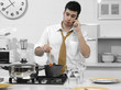 business man in the kitchen talking on the phone