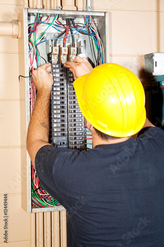 Photo: Electrician Replaces Breaker Electrician Replaces Breaker