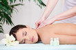 Woman on back massage in spa center Woman on back massage in spa center