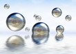 glassy spheres floating on the water glassy spheres floating on the water