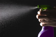 hands clean with a spray bottle