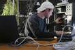 man repairs computer