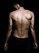 Artistic grunge image of man with muscular back