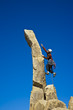 Rock climber nearing the summit.