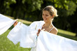 Photo: Funny woman hanging clothes Funny woman hanging clothes