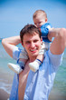 Photo: dad and son on the beach dad and son on the beach