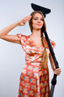 Funny housewife with vacuum cleaner